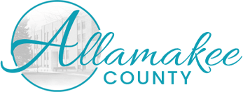 Logo of Allamakee County with cursive letter "A" and building image in the background.